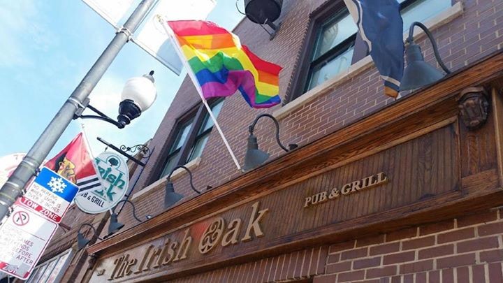 Lgbt Community Gay Club with Rainbow Flag on the Facade of a Brick